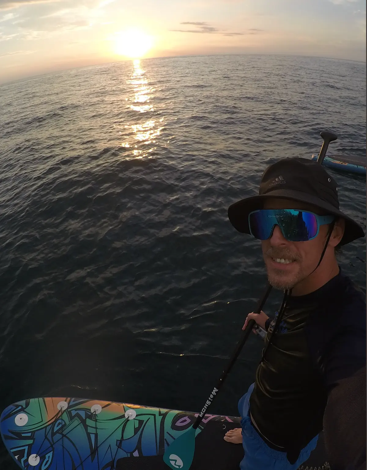 Brent paddleboarding at sunset in Puerto Vallarta